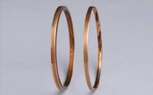 Figure 1: Oil rings are not a state-of-art component. Note new ring on left, badly worn ring on right